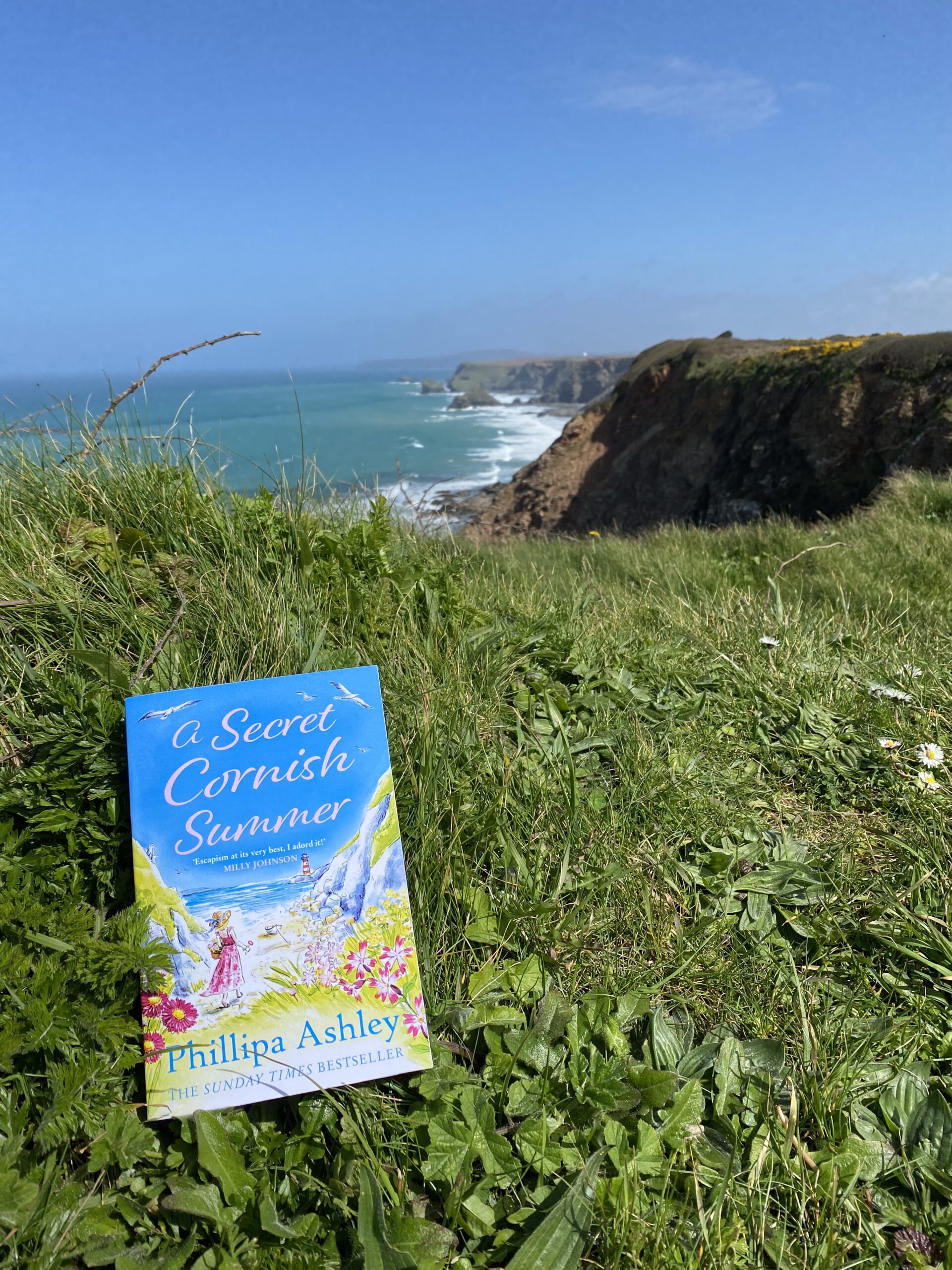 A Secret Cornish Summer by Phillipa Ashley overlooking the Cornish coast 